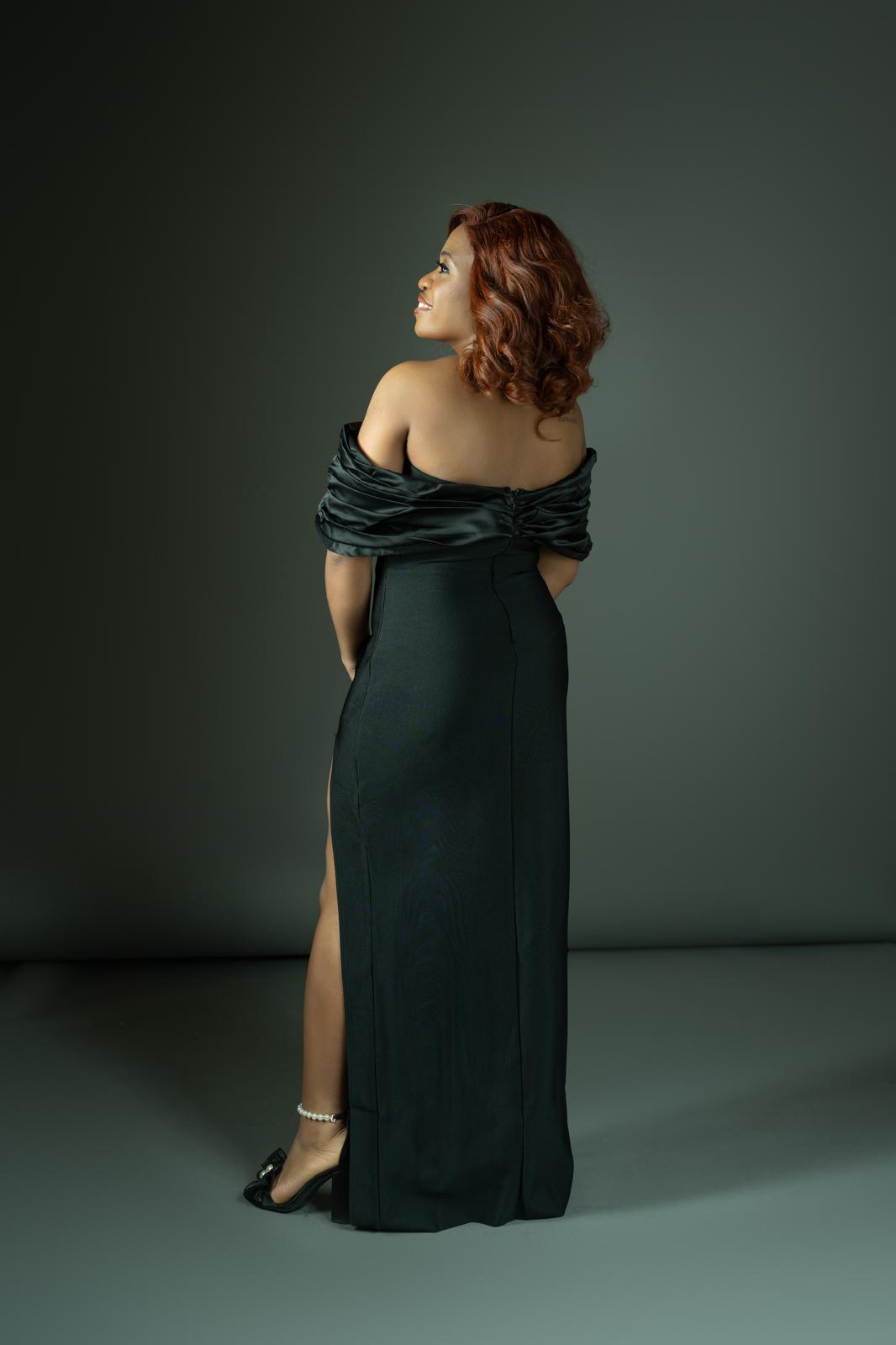 Ifedayo in green off-shoulder gown